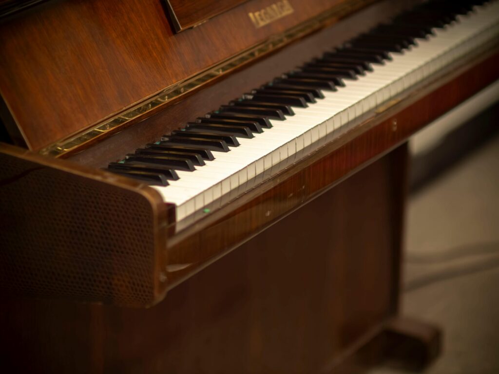 Close-up of a classic wooden piano keyboard in a cozy indoor setting, Poland.