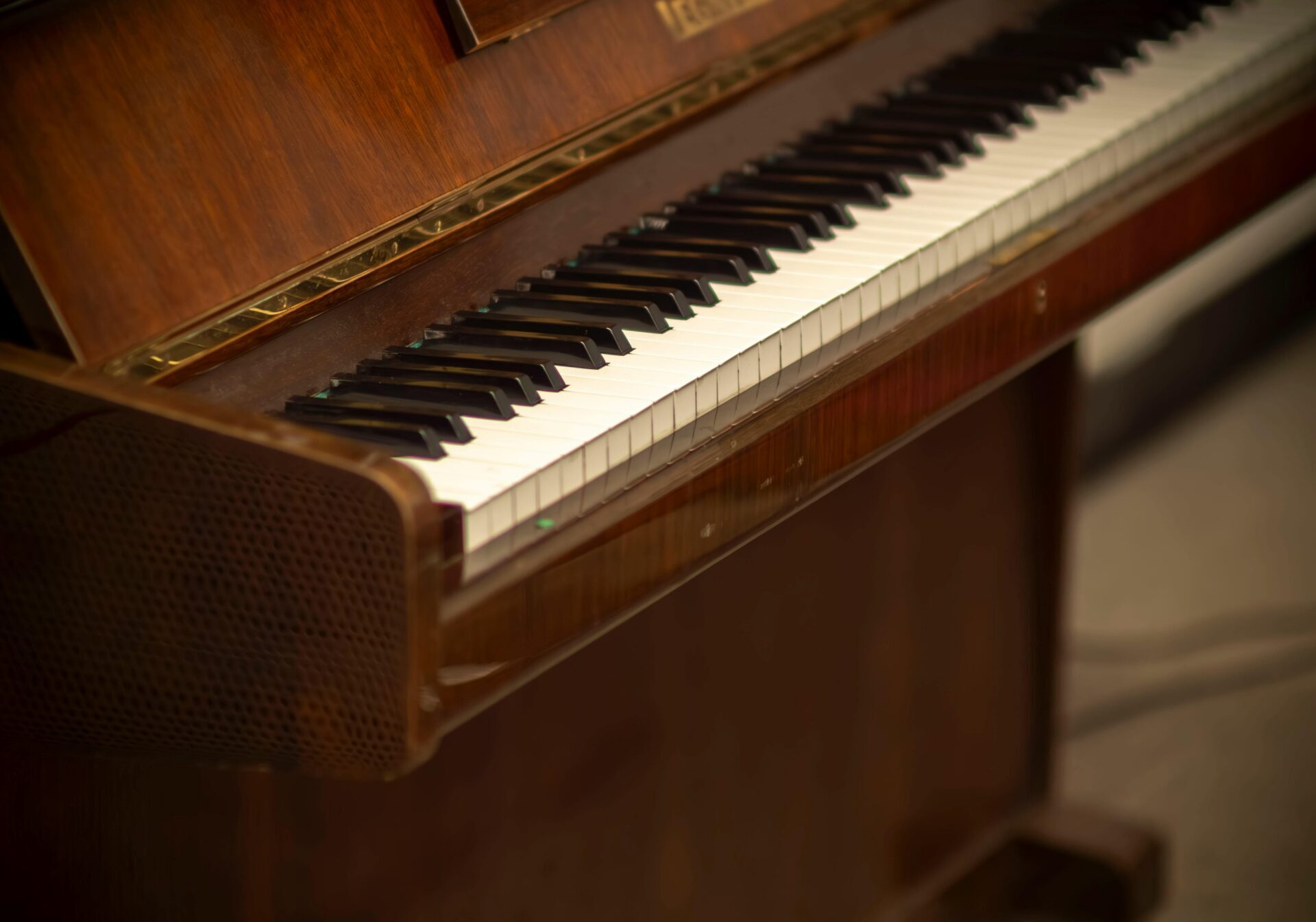 Close-up of a classic wooden piano keyboard in a cozy indoor setting, Poland.